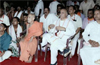 Photo of Togadia sitting cross-legged next to Pejawar seer goes viral